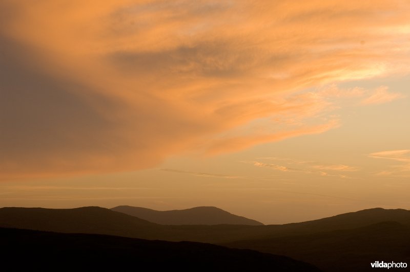 Wolkenlucht boven hellingvenen